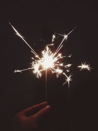 Low angle view of firework display at night