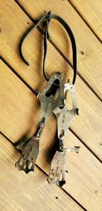 High angle view of chain on wooden table