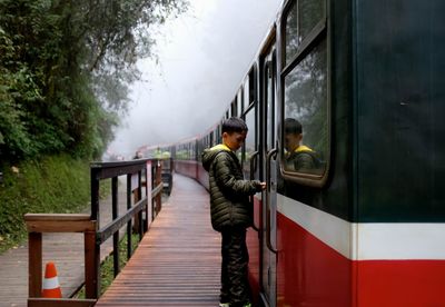 People standing on footbridge