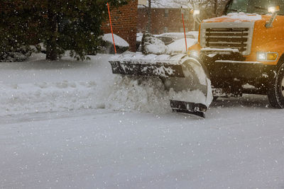 Snow on street in city during winter