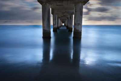 Long exposure of the underlying part of the pier on the beach of marina di largo abruzzo at dawn