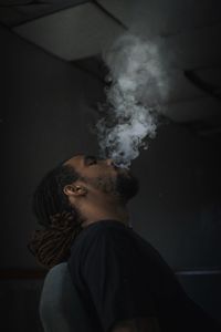 Portrait of young man smoking