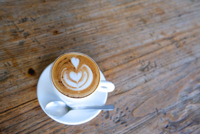 Close-up of cappuccino on table
