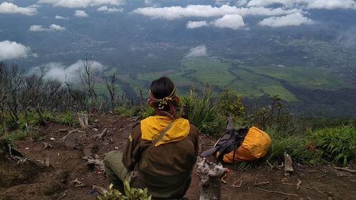 Rear view of man looking at mountains