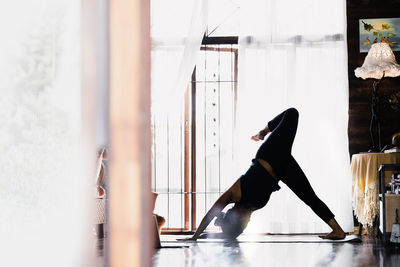 Rear view of man standing in gym