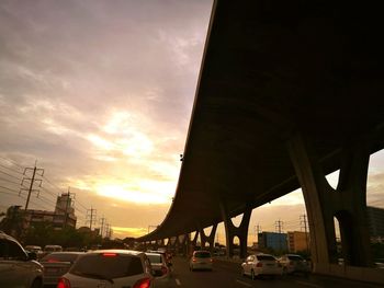 Car moving on road at sunset