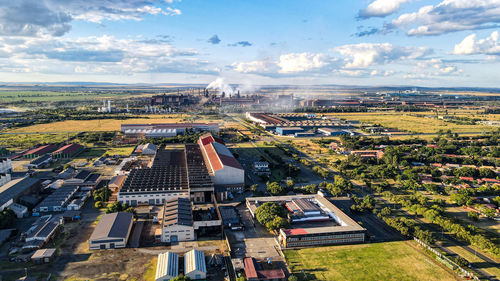 High angle view of buildings in city against sky