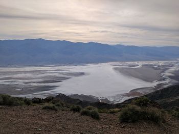 Scenic view of landscape and mountains against sky