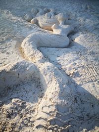 High angle view of sand mermaid