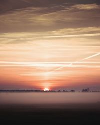 Scenic view of landscape against sky during sunset