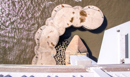 High angle view of statue by water