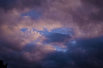 Low angle view of cloudy sky during sunset