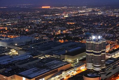 High angle view of illuminated buildings in city at night