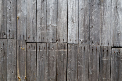 Gray messy wooden planks wall suface texture and background