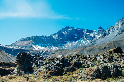 Scenic view of snowcapped mountains against sky