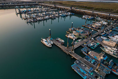 Boats moored at harbor