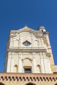 Low angle view of building against blue sky