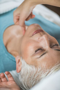 Close-up of woman getting massage at spa