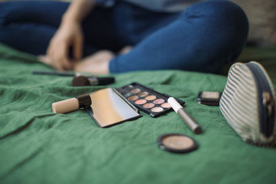 Close-up of man relaxing on bed