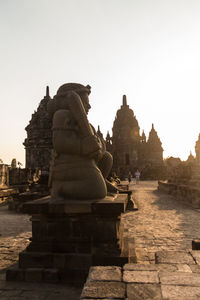 Statue of historic building against clear sky