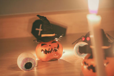 Close-up of illuminated candles on table