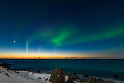 Scenic view of sea against sky at night