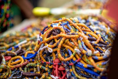 Colorful necklaces and bracelets for sale at market stall