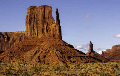 Rock formations on landscape against sky