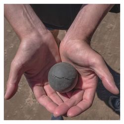 Close-up of hand holding ball