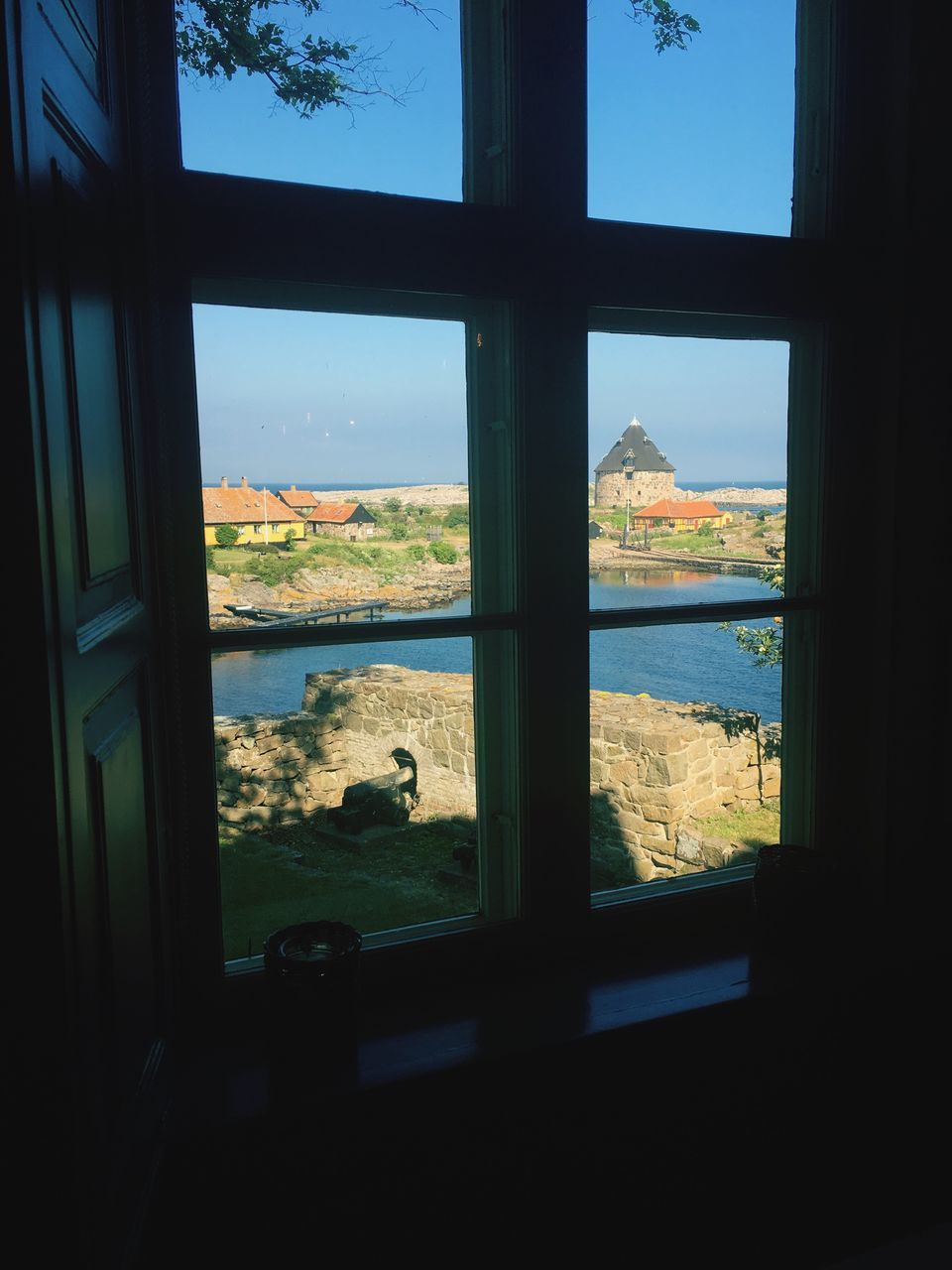 indoors, window, water, sea, transparent, sky, glass - material, built structure, architecture, looking through window, day, no people, nature, horizon over water, animal themes, river, beach, reflection, silhouette, cloud