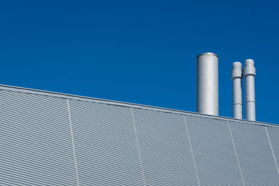 Low angle view of building against blue sky