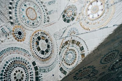 Low angle view of clock on ceiling of building