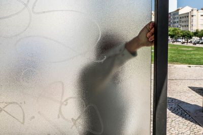 Reflection of man on glass window