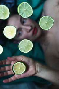 Cropped hand of woman holding plant