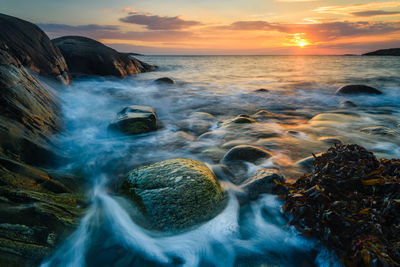 Scenic view of sea against sky during sunset