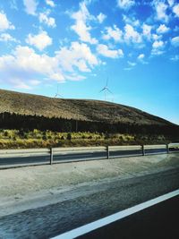 Road by land against sky