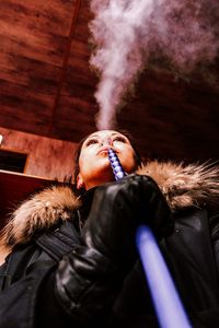 Close up shot of young woman smoking