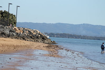 Scenic view of beach against clear sky