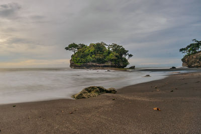 Scenic view of beach against sky