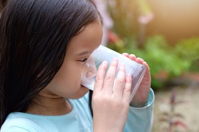 Close-up of girl drinking water