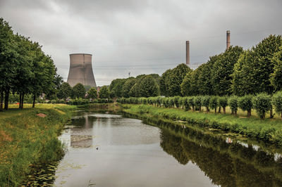 Canal and nuclear power plant near geertruidenberg. a small village in the netherlands countryside.