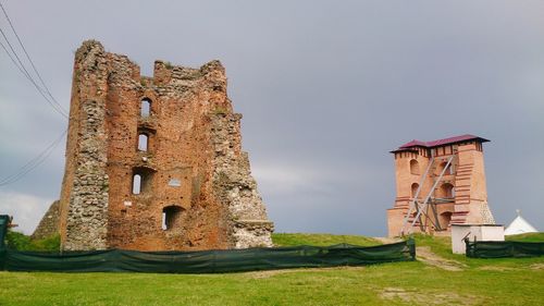 Low angle view of old building against sky