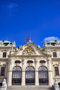 Low angle view of building against blue sky