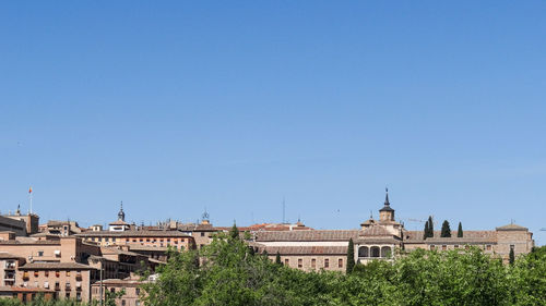 Buildings against blue sky