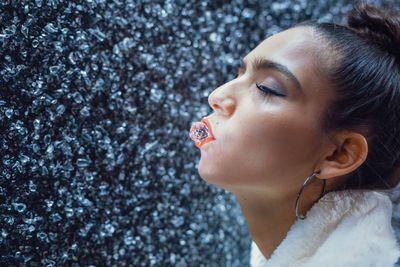 Woman carrying quartz in mouth