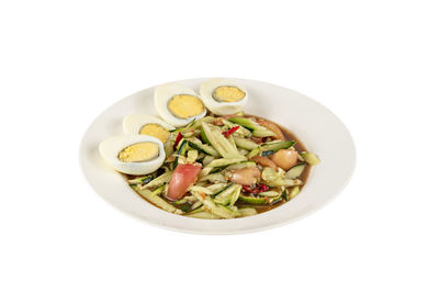 Directly above shot of salad in bowl against white background