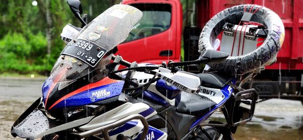 Close-up of bicycle parked against blurred background