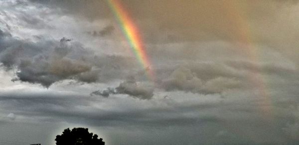 Low angle view of rainbow in sky