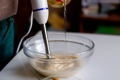 Cropped hand holding drink