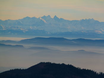 Scenic view of mountains against sky during sunset